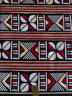 Pagne wax Bogolan rouge/noir motifs graphiques ancestraux africains