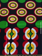 Pagne wax noir avec des motifs géométriques rouges, jaunes & verts
