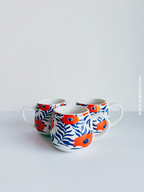 Mug en porcelaine fleurs oranges et bleues - 36 cl